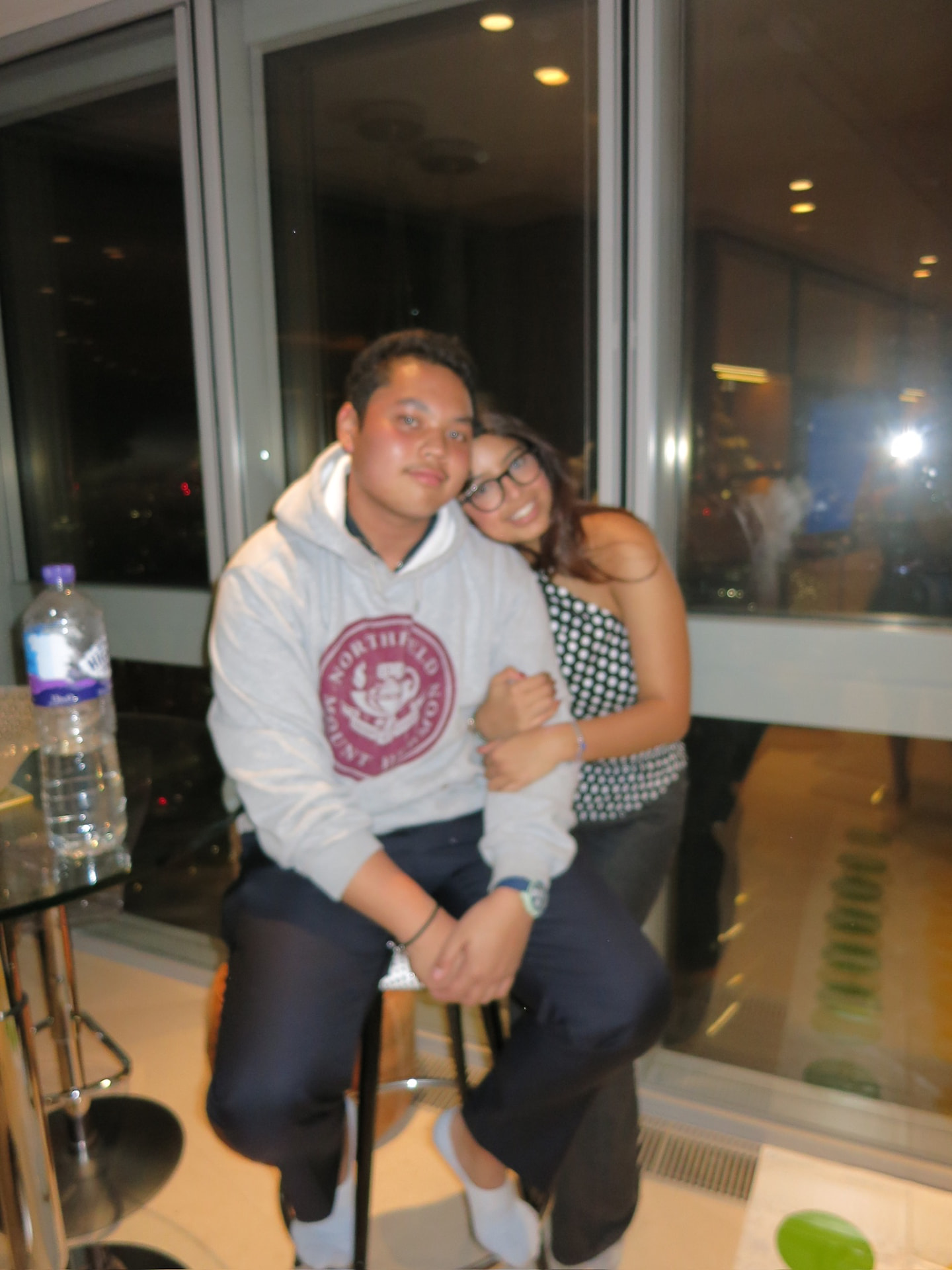 Us sitting together by the window at night
