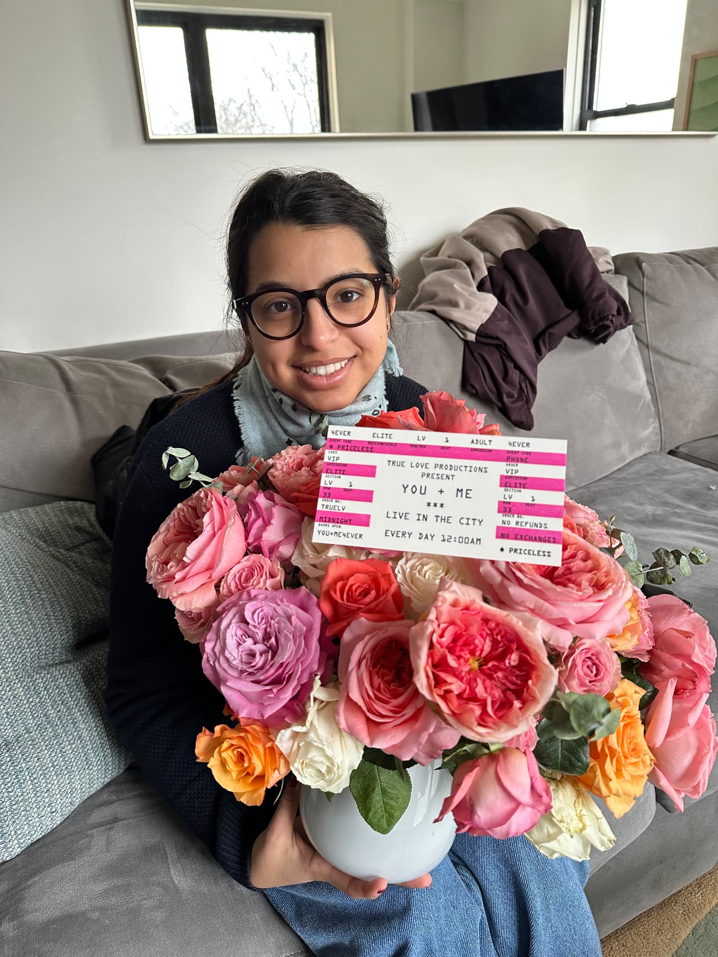 Her holding a bouquet of roses